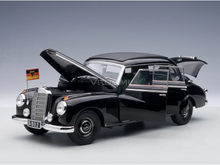 Black Mercedes-Benz 300D scale model car with open doors and hood, German flag, from Vroomi