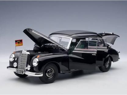 Black Mercedes-Benz 300D scale model car with open doors and hood, German flag, from Vroomi