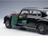 Black Mercedes-Benz scale model car with open doors, green interior, at Vroomi
