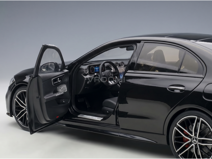 Black Mercedes-AMG scale model car with open door, detailed interior, at Vroomi