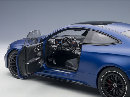 Blue Mercedes-AMG scale model car with open door, detailed interior, showcased by Vroomi