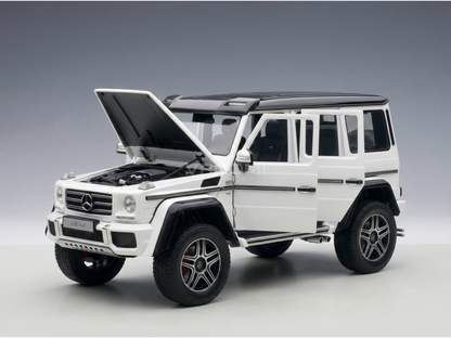 White Mercedes-Benz G500 4x4² scale model car with open hood and doors, showcased by Vroomi