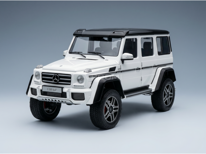 White Mercedes-Benz G 500 4x4² scale model car with black accents, showcased by Vroomi for collectors.