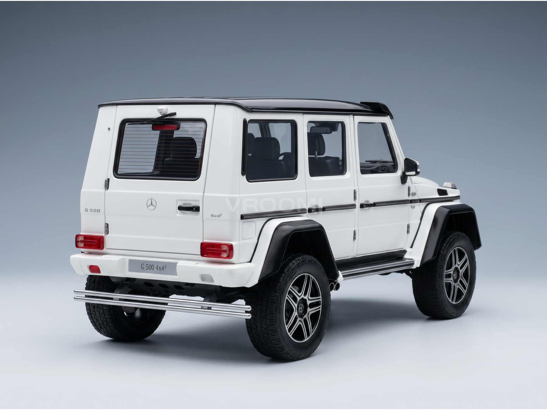 White Mercedes-Benz G500 4x4² scale model car from Vroomi, detailed rear three-quarter view