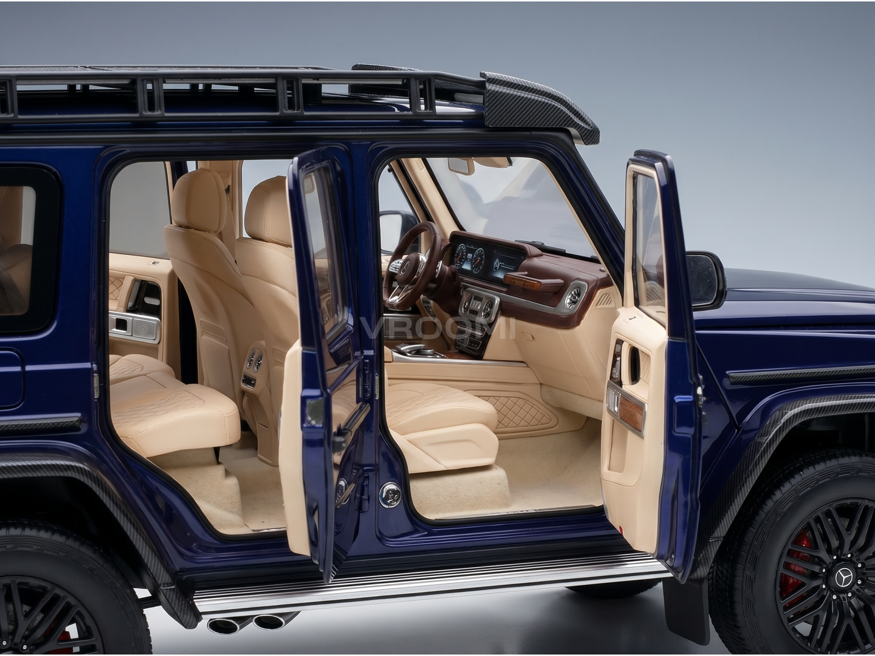 Blue scale model car with open doors, tan interior, carbon fiber details — Vroomi