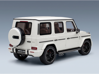 White Mercedes-AMG G63 scale model car from Vroomi, featuring black rims and detailed exterior design.