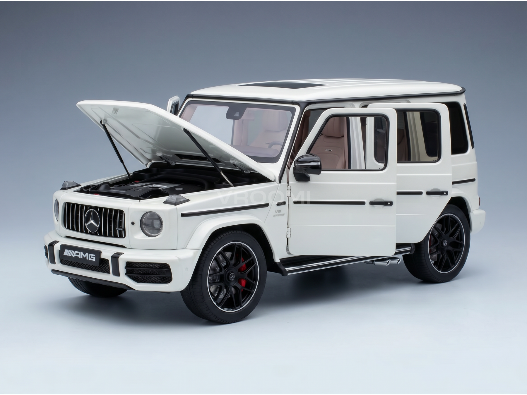 White Mercedes-AMG G63 scale model car with open hood and doors, detailed engine, black wheels — Vroomi