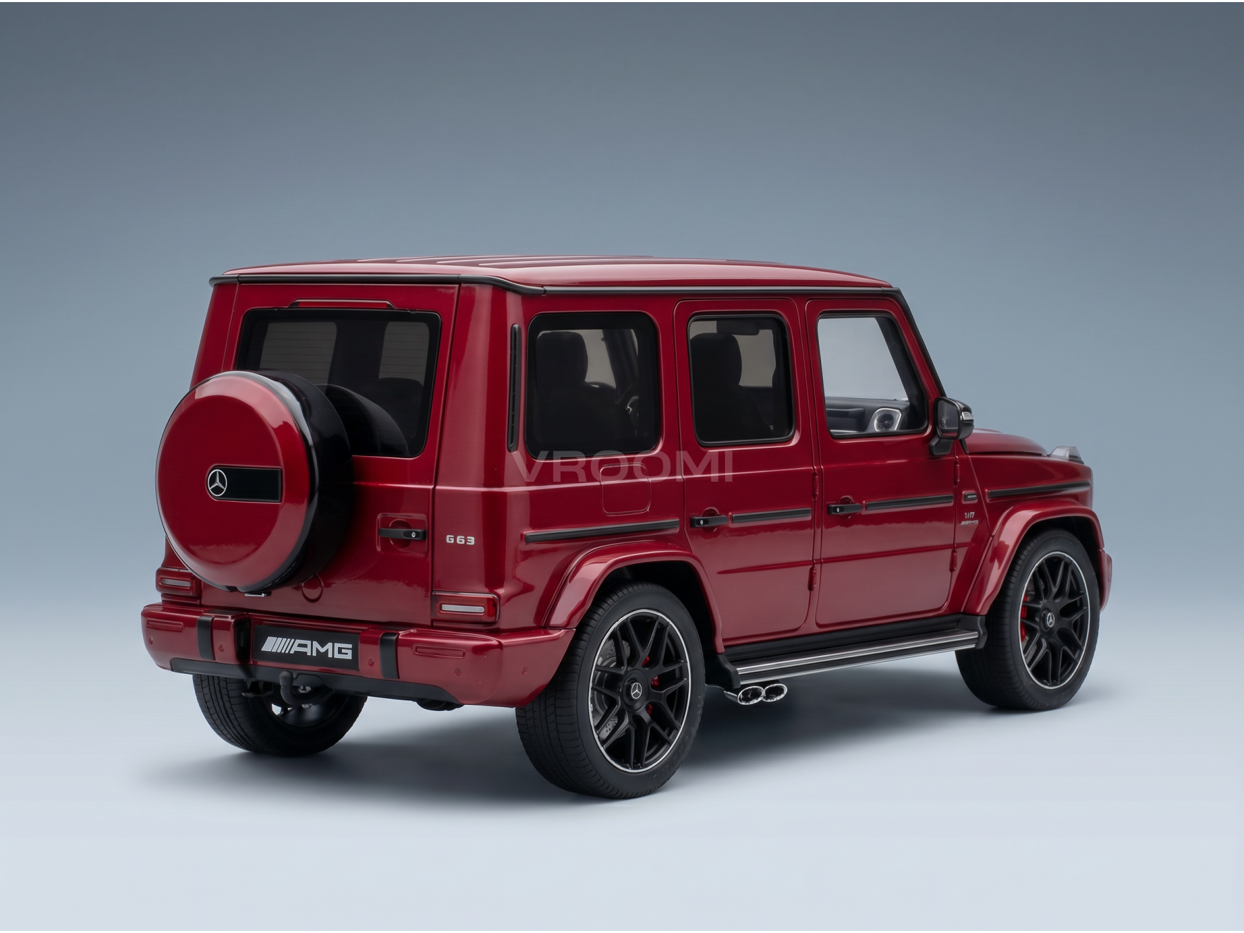 Red Mercedes-AMG G63 scale model car from Vroomi, showcasing detailed 1/18 replica with black rims and spare tire.