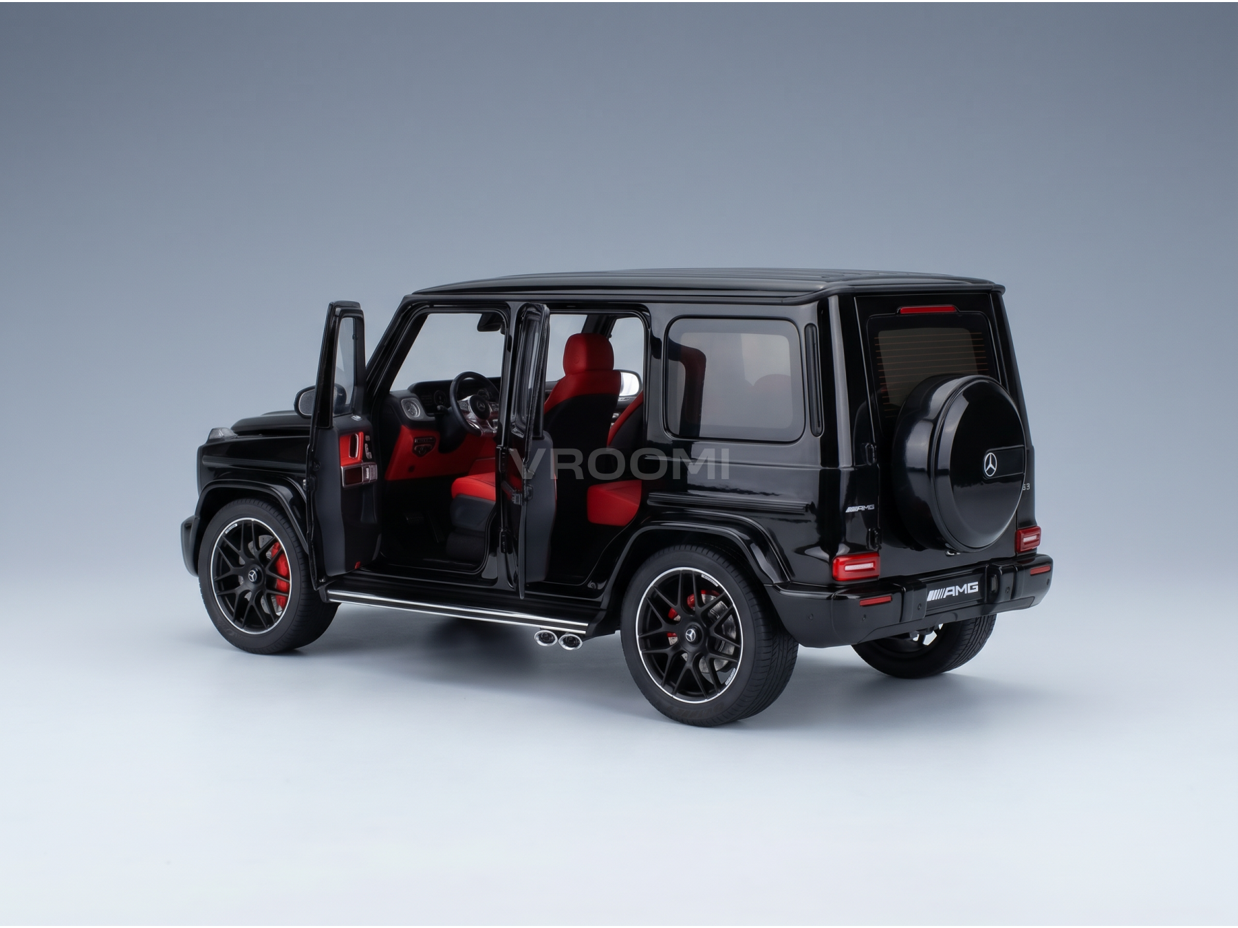Black Mercedes-AMG G63 scale model car with red interior, showcased by Vroomi for collectors.