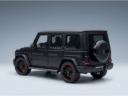 Black Mercedes-AMG G63 scale model car with red-accent wheels, showcased by Vroomi for collectors.