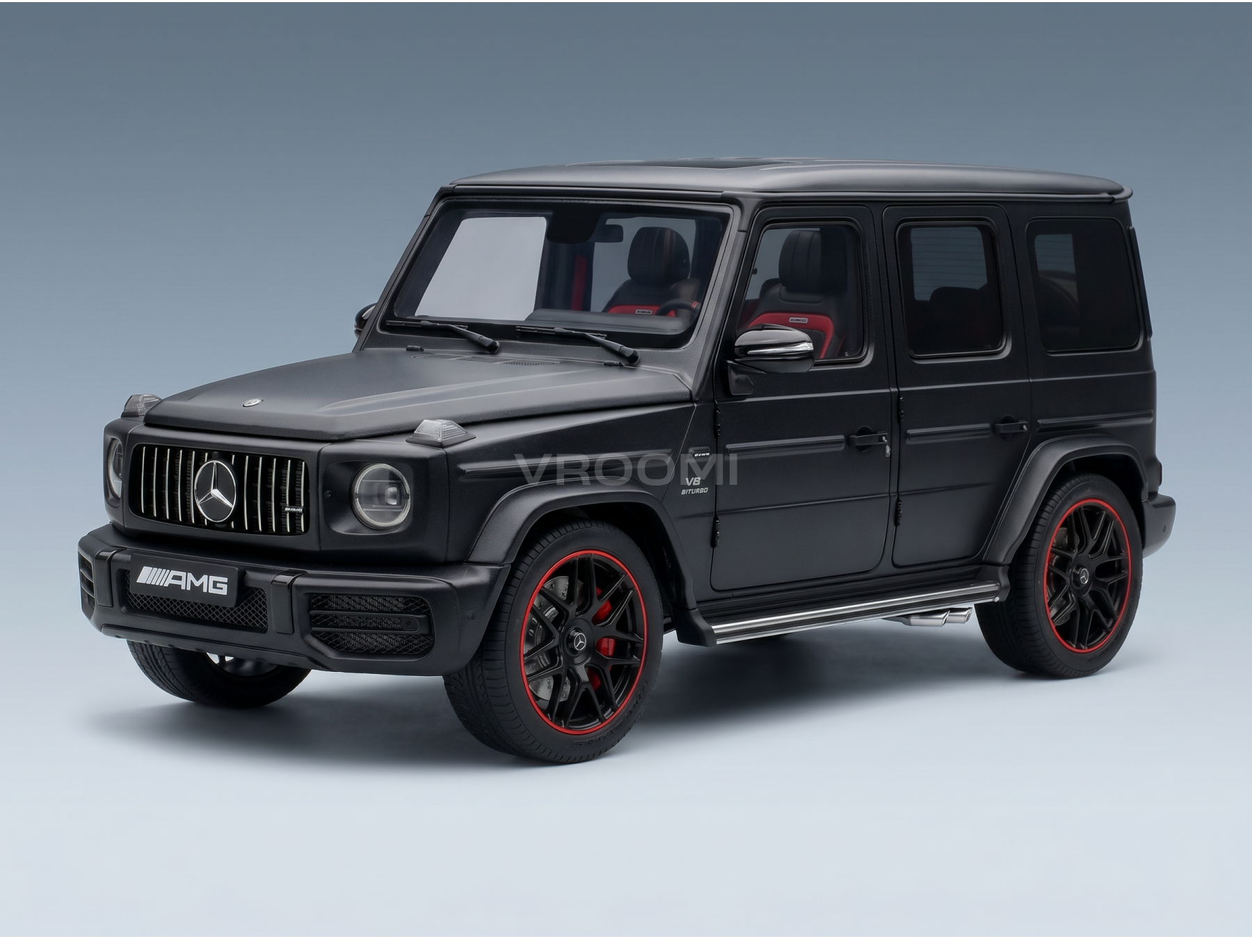 Black Mercedes-AMG G63 scale model car with red accents, showcased by Vroomi for collectors.