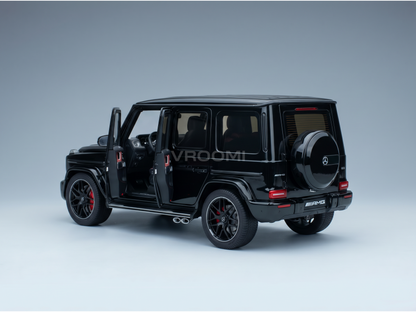 Black Mercedes-AMG G63 scale model car with open doors, showcased by Vroomi for collectors.