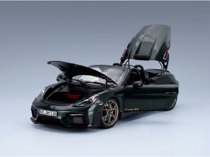Green Porsche Spyder RS scale model car with open hood and roof, showcased by Vroomi