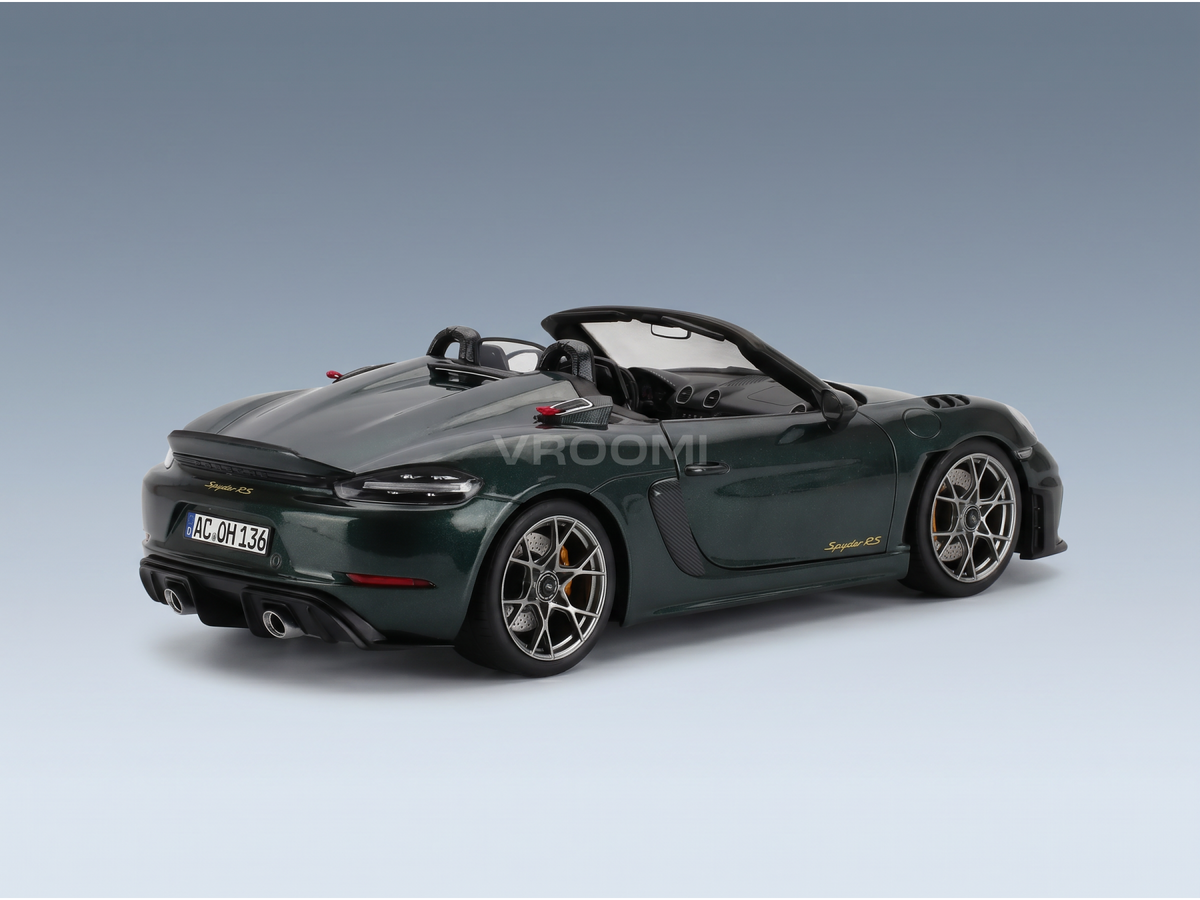 Green Porsche Spyder RS scale model car from Vroomi, showcasing sleek design and detailed wheels.