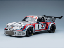 Porsche-Audi Martini Racing scale model car with number 9, showcased by Vroomi for collectors.