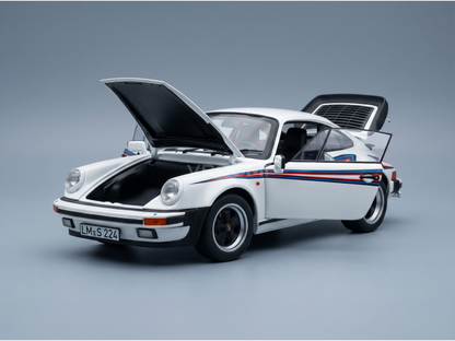 White Porsche 911 scale model car with open hood and doors, featuring red and blue stripes, from Vroomi