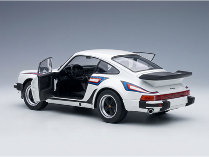 White Porsche Turbo scale model car with open door, detailed interior, and racing stripes — Vroomi