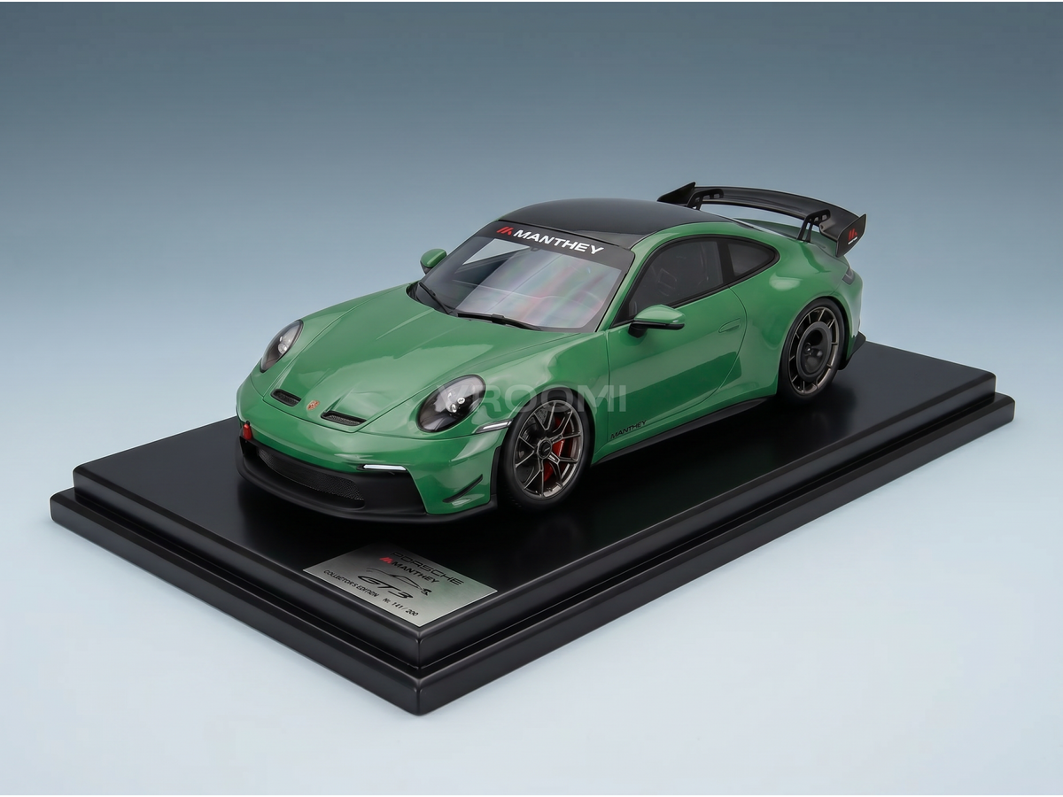 Green Porsche GT3 RS scale model car by Vroomi, featuring Manthey branding and sleek design.