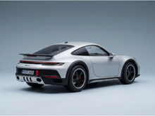 Silver Porsche 911 Dakar scale model car from Vroomi, featuring black wheels and rear spoiler