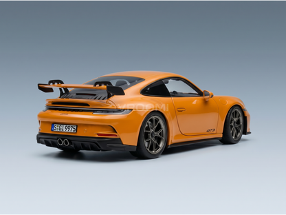 Orange Porsche GT3 scale model car from Vroomi, showcasing sleek design and rear spoiler