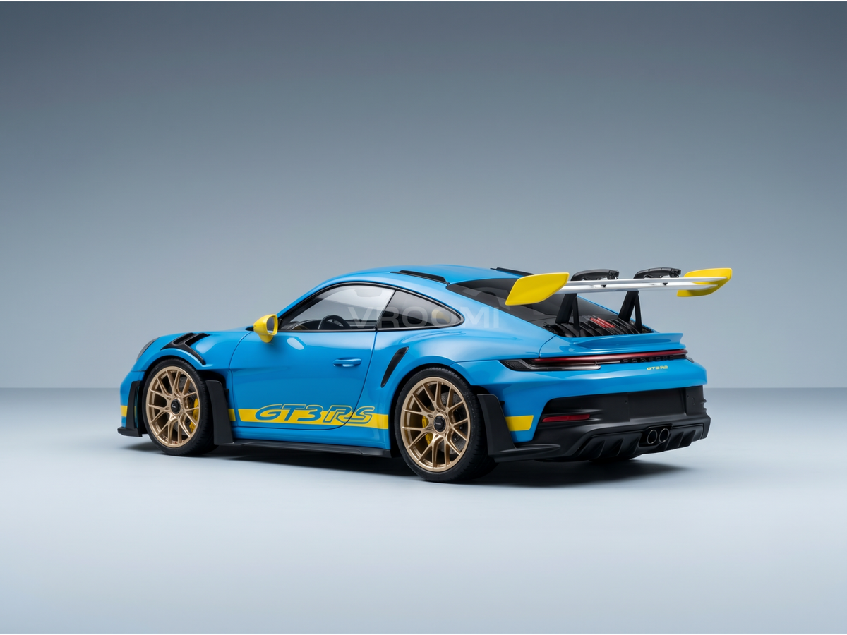 Blue Porsche GT3 RS scale model car with yellow accents, gold wheels, and rear wing — Vroomi