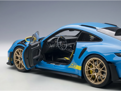 Blue scale model car with open doors, gold wheels, yellow accents — Vroomi collector replica