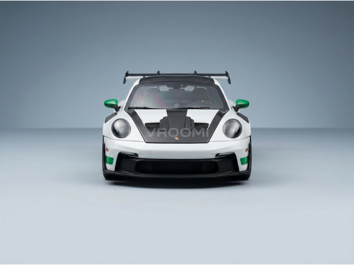 White Porsche scale model car with green accents, showcased at Vroomi for collectors.