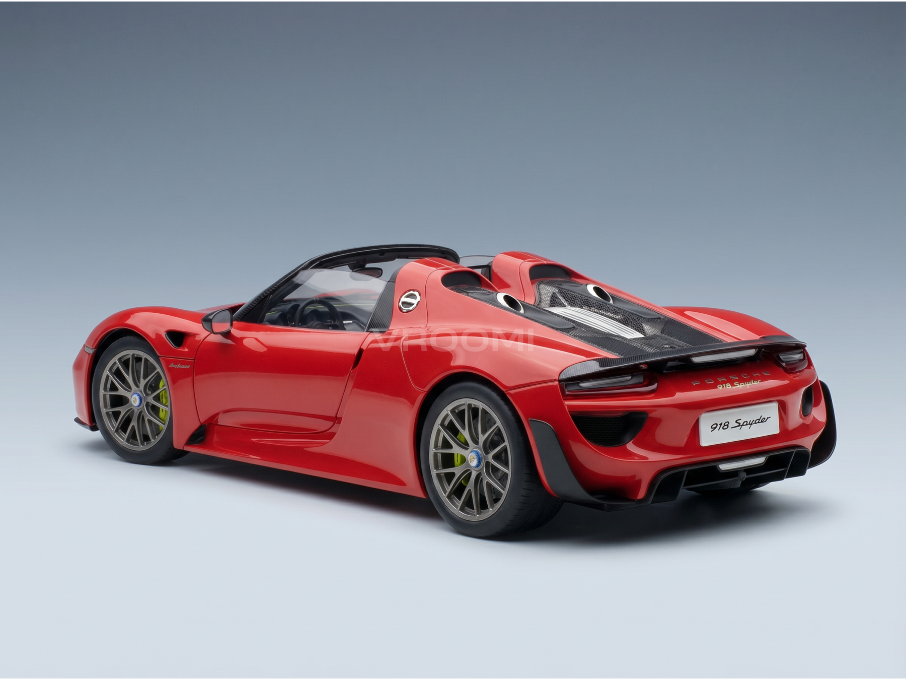 Red Porsche 918 Spyder scale model car from Vroomi, showcasing sleek design and detailed craftsmanship.