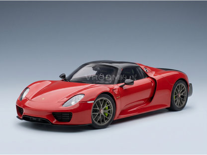 Red Porsche 918 Spyder scale model car with black roof and green brake calipers, showcased by Vroomi