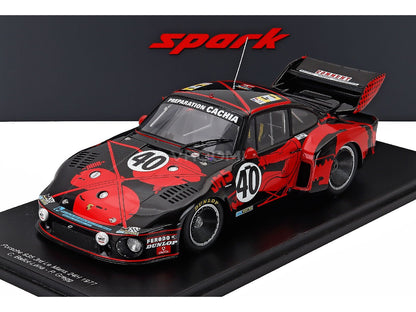 Porsche 935 scale model car with red and black livery, displayed at Vroomi for collectors.