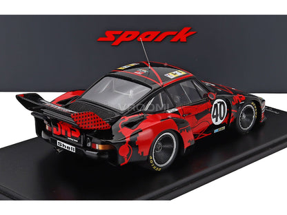 Red and black scale model car with racing decals, displayed at Vroomi