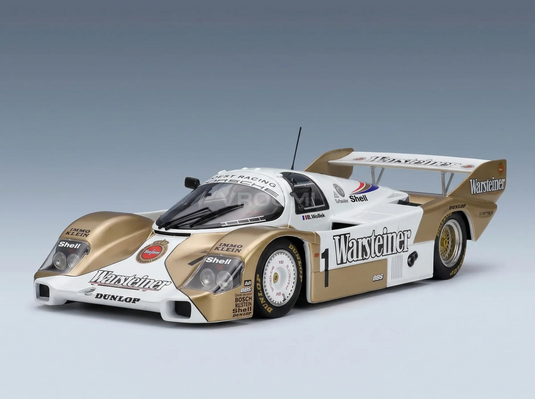 PORSCHE - 956B JAGERMEISTER TEAM BRUN MOTORSPORT N 1 NORISRING DRM-KAMPIOEN 1984 STEFAN BELLOF - WHITE GOLD Vroomi Schaalmodellenwinkel
