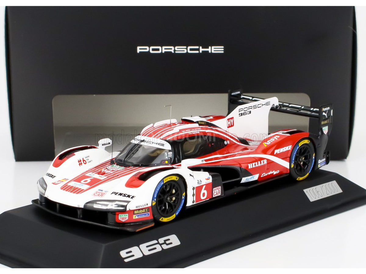 Porsche 963 scale model car by Vroomi, featuring red and white livery with detailed sponsor decals.