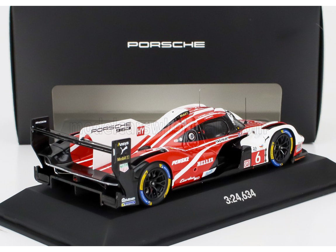 Porsche 963 scale model car by Vroomi, featuring red and white livery with detailed sponsor logos and racing decals.