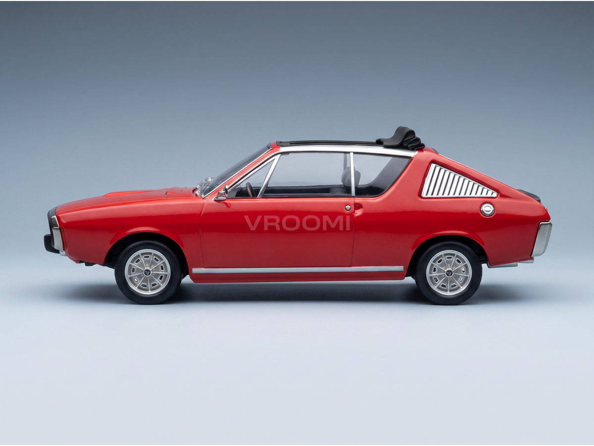 Red scale model car with silver wheels and roof spoiler, showcased by Vroomi for collectors