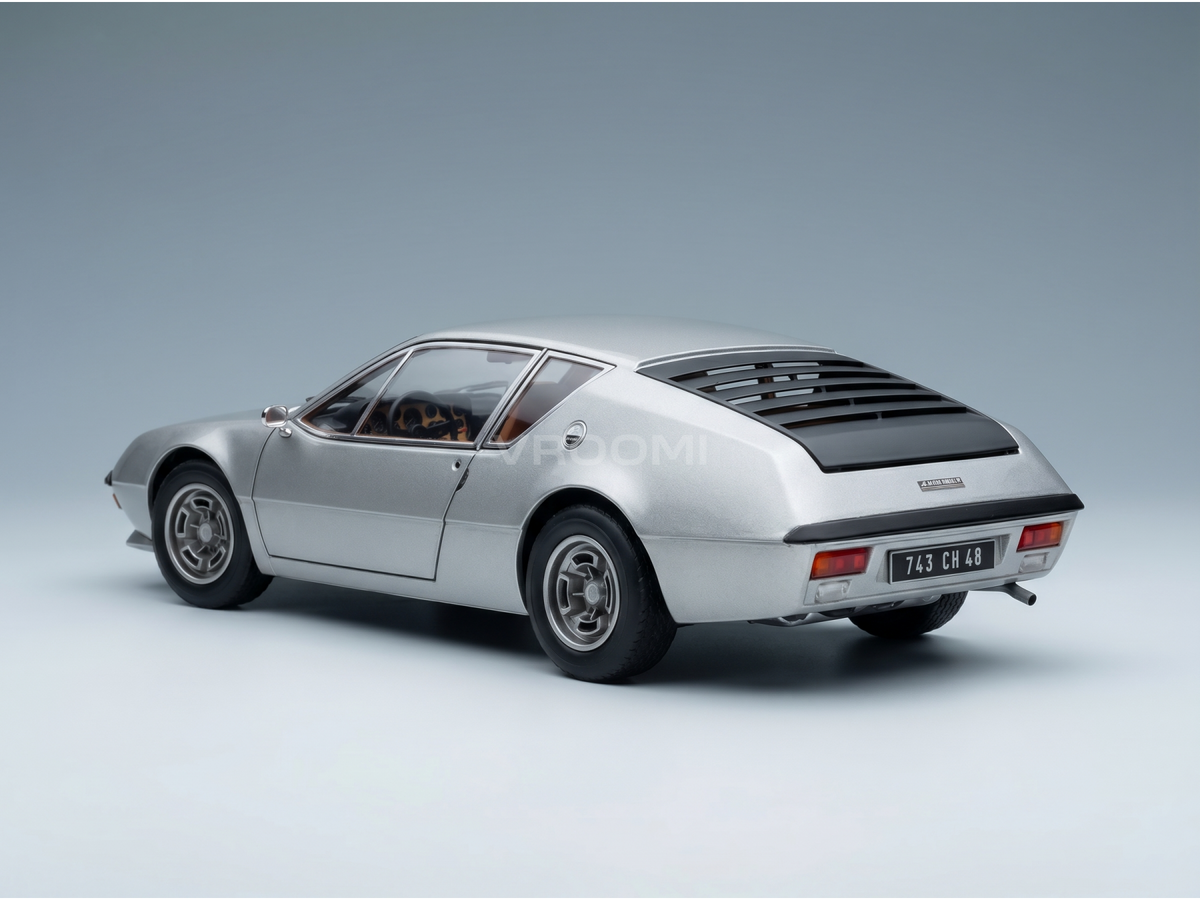 Silver scale model car with sleek design, showcased by Vroomi for collectors and motorsport fans.