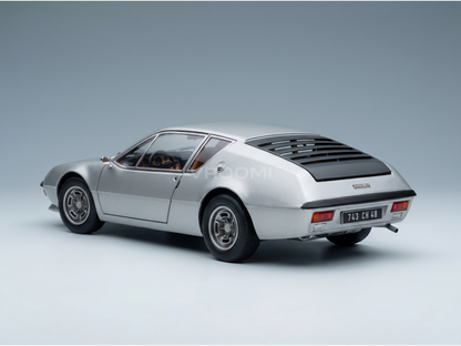 Silver scale model car with sleek design, showcased by Vroomi for collectors and motorsport fans.
