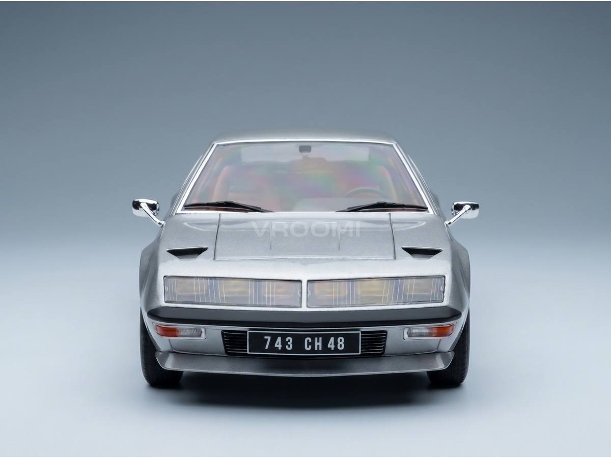 Silver scale model car with sleek design, showcased by Vroomi for collectors and motorsport fans.