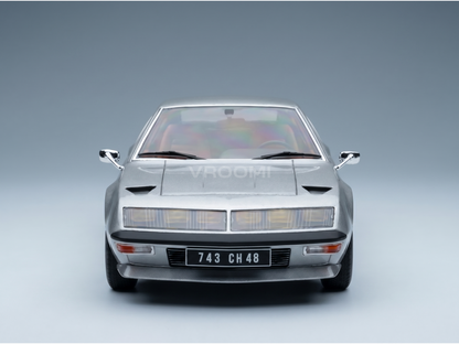 Silver scale model car with sleek design, showcased by Vroomi for collectors and motorsport fans.