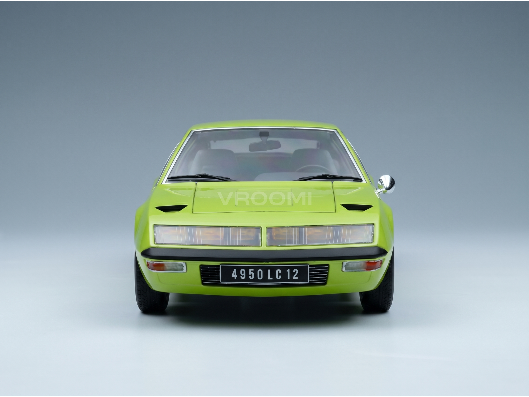 Vroomi scale model car in vibrant lime green, showcasing classic design and detailed front view.