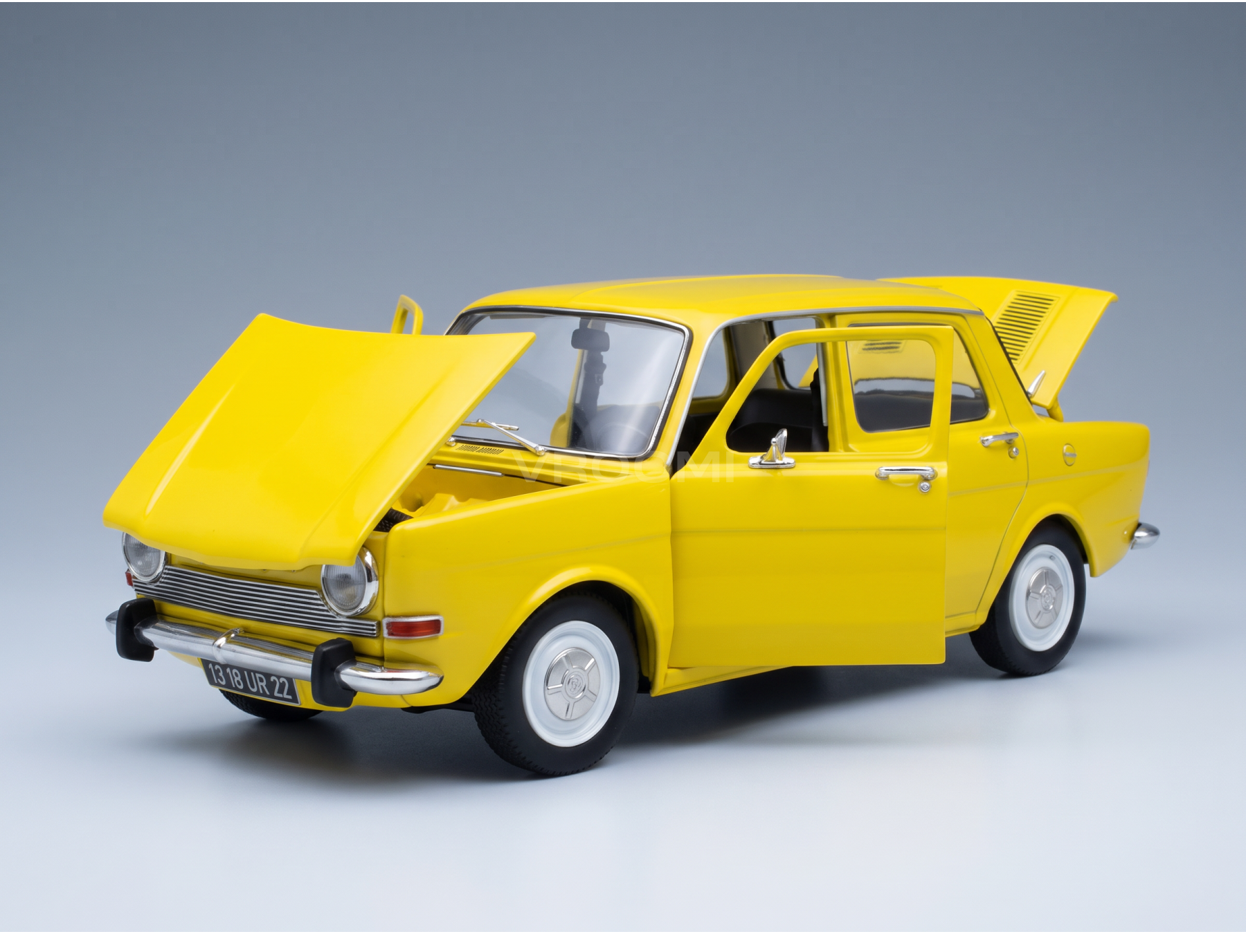 Vroomi yellow scale model car with open hood, doors, and trunk, showcasing detailed interior and exterior design.