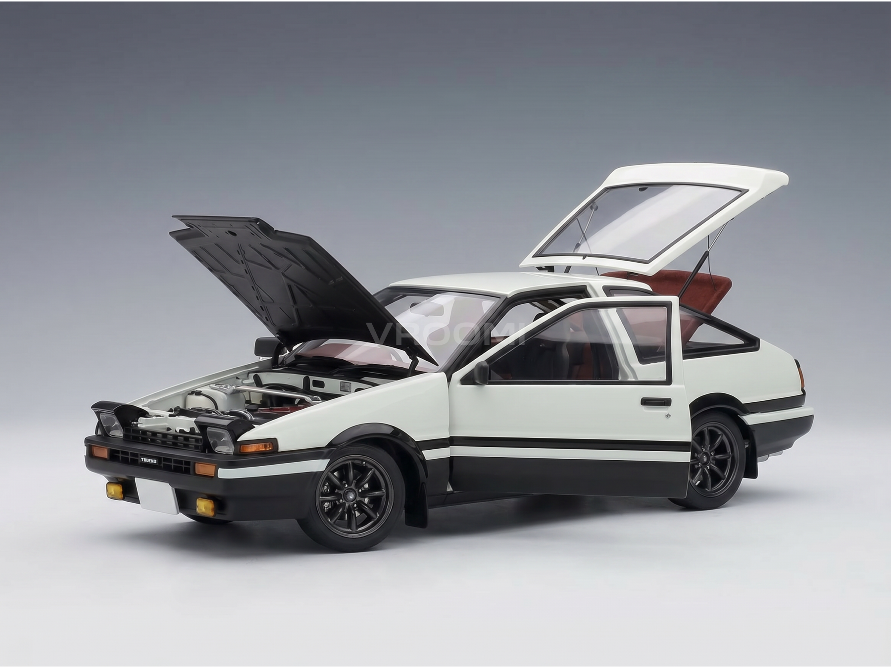 White scale model car with open hood and doors, detailed engine, Vroomi collection
