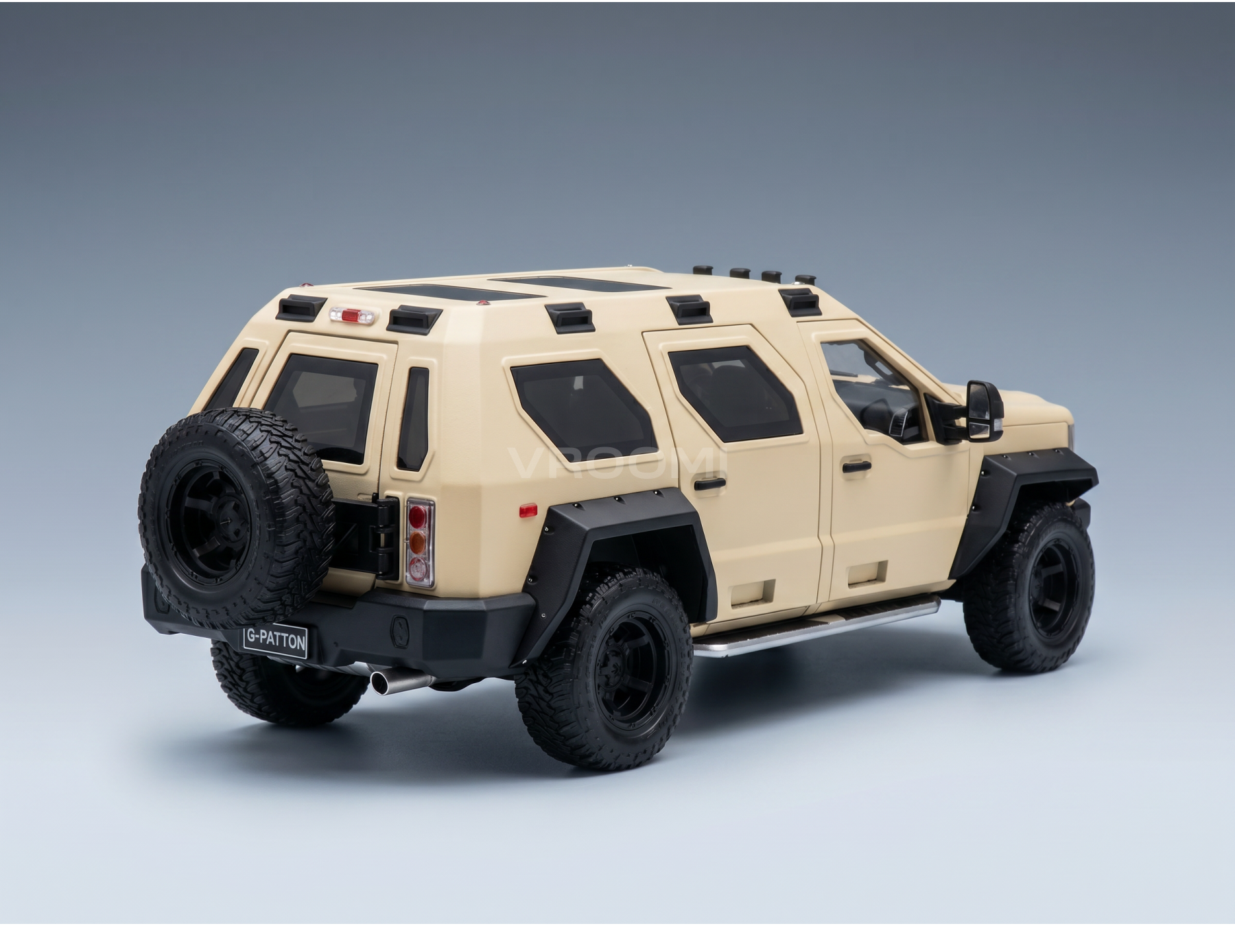 Beige G-PATTON armored SUV scale model car from Vroomi, featuring black wheels and rugged tires.