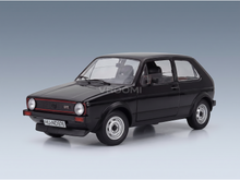 Black Volkswagen Golf GTI scale model car from Vroomi, detailed die-cast replica with red grille trim and classic wheels