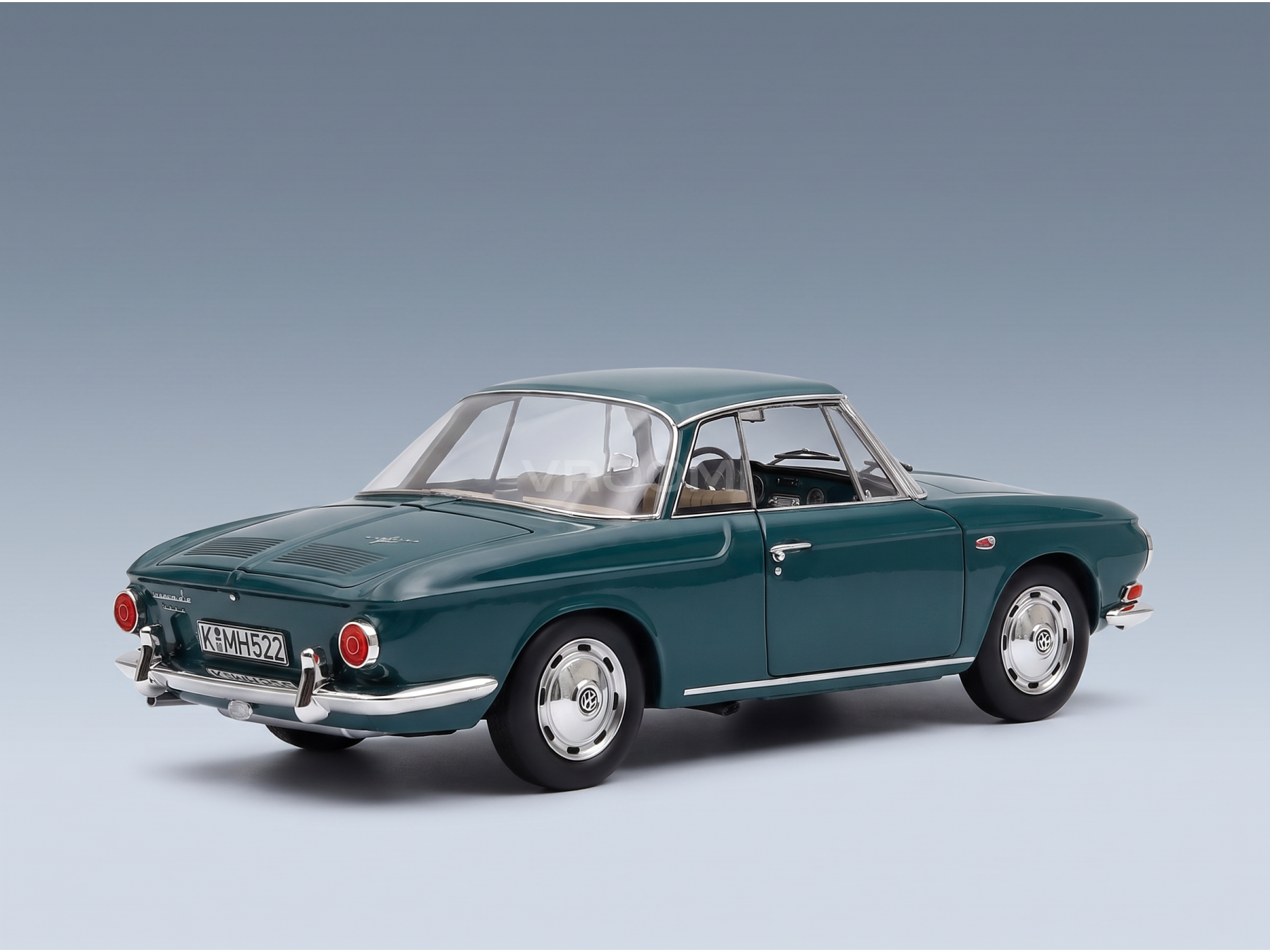 Vroomi scale model car: classic green Volkswagen Karmann Ghia replica with chrome details and 1/18 finish