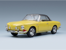 Yellow Volkswagen Karmann Ghia scale model car from Vroomi, featuring chrome details and classic design.