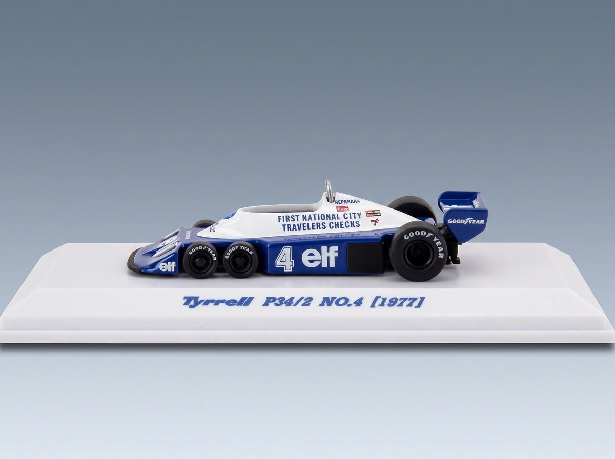 Tyrrell P34/2 Elf No. 4 Patrick Depailler 1977 Kyosho 1:64 scale model - side view on display base