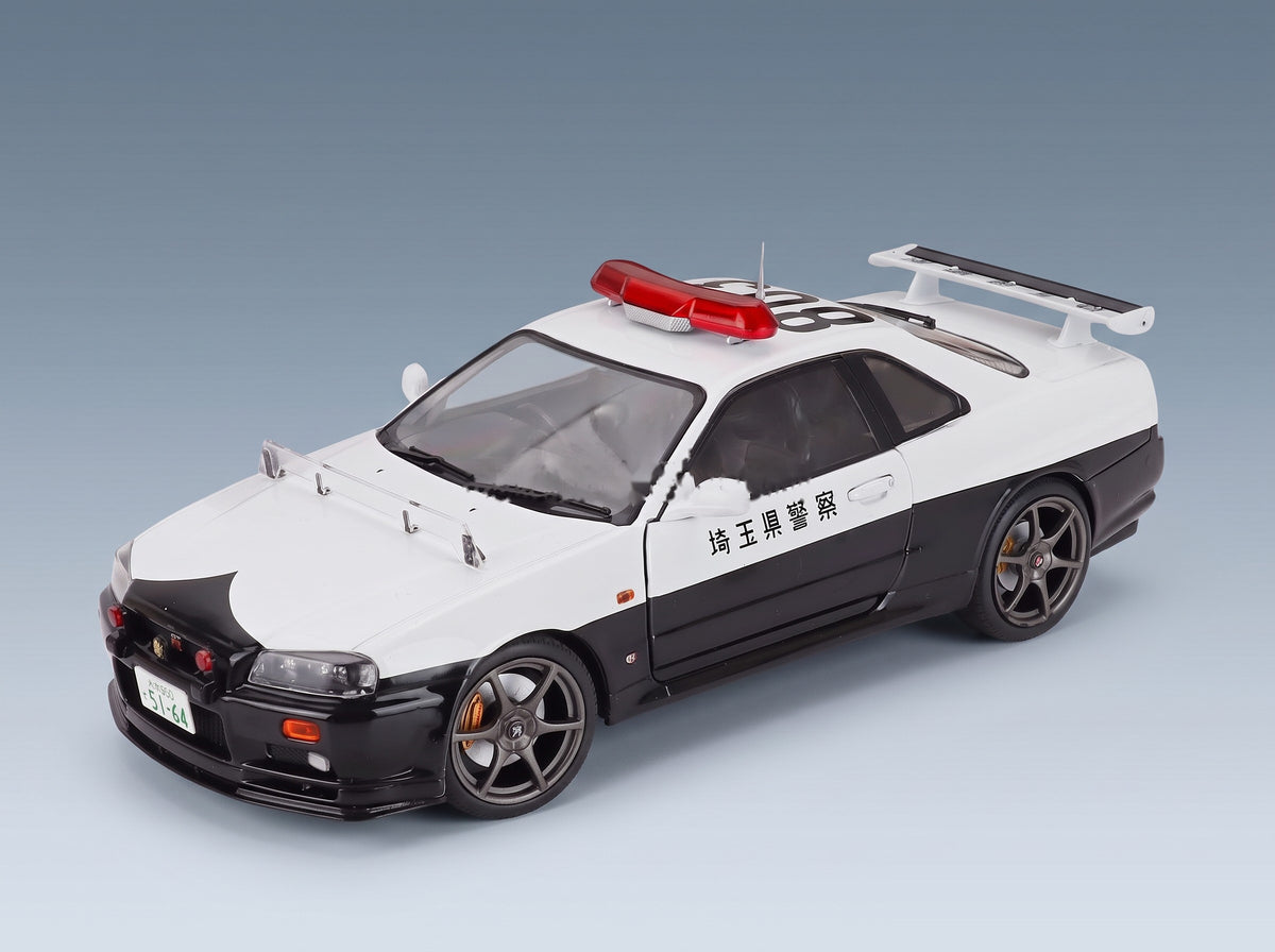 Nissan Skyline GT-R (BNR34) Japan Police 2019 White Black Solido 1:18 - front three-quarter view