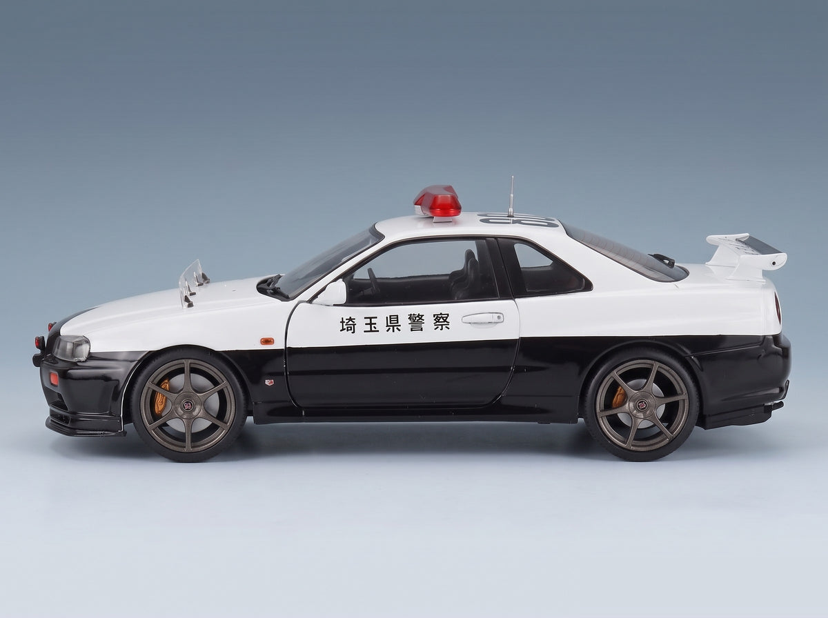 Nissan Skyline GT-R (BNR34) Japan Police 2019 White Black Solido 1:18 - side view