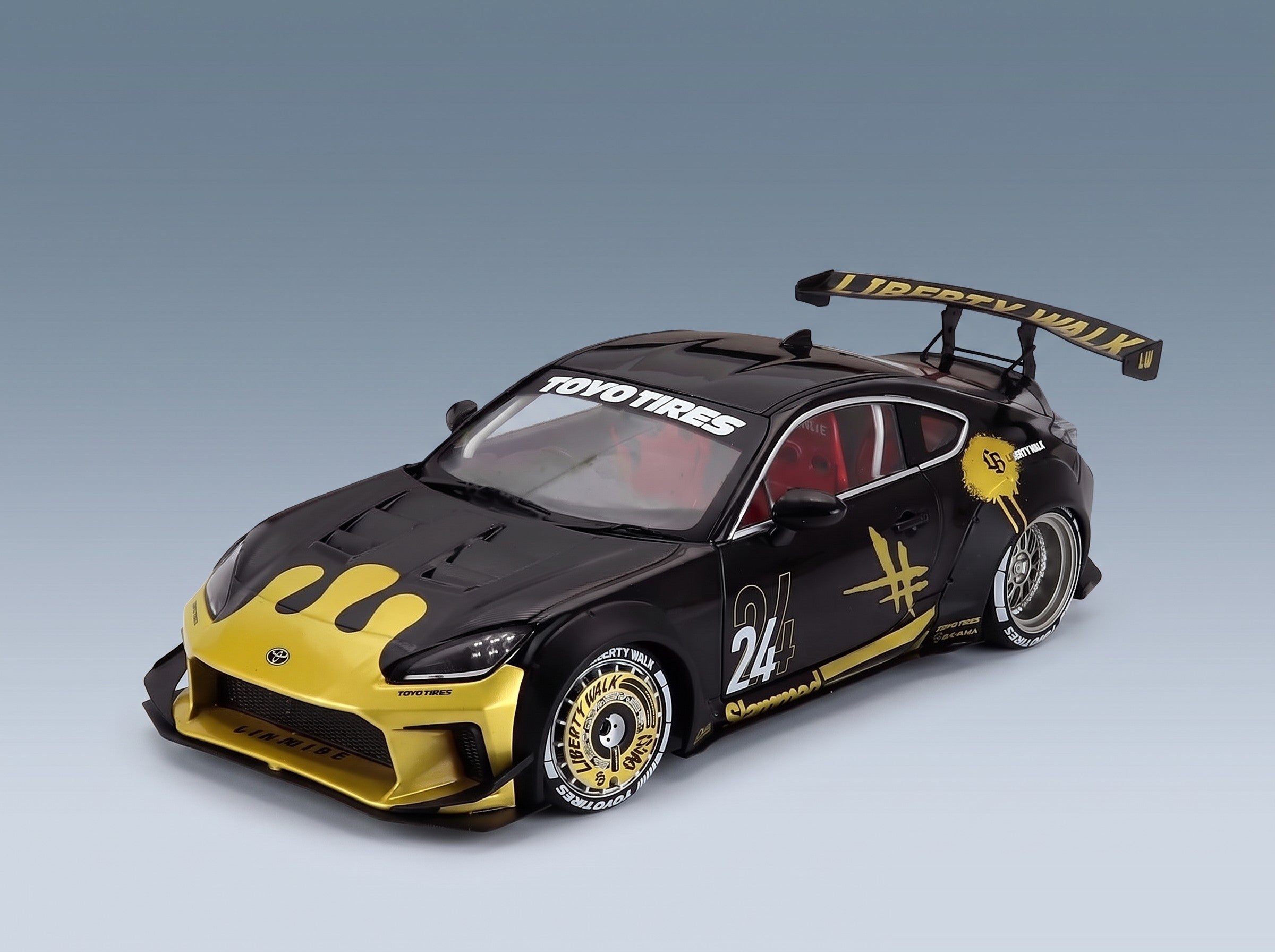 Toyota GR86 LBWK Body Kit No. 24 Coupé 2024 Black Gold Solido 1:18 scale model - front three-quarter view